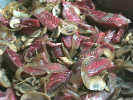 add the meat to the mushrooms and onions