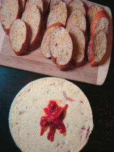 roasted red bell pepper cheesecake served with crostini